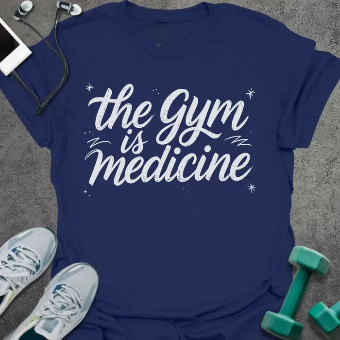 Navy t-shirt printed with "the gym is medicine" in white, with sparkles and decorative lines