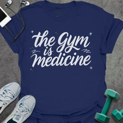 Navy t-shirt printed with "the gym is medicine" in white, with sparkles and decorative lines