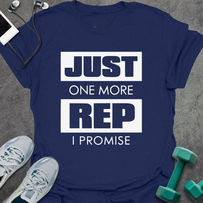 Navy t-shirt printed with "Just One More Rep I Promise" in white and green, with a kettlebell and dumbbell