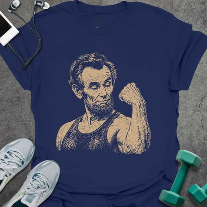 Navy t-shirt with a portrait of Abraham Lincoln holding a medicine ball in white