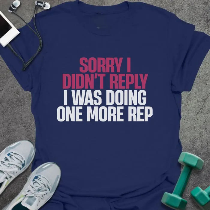 Navy t-shirt printed with "Sorry I Didn't Reply I Was Doing One More Rep" in white and pink