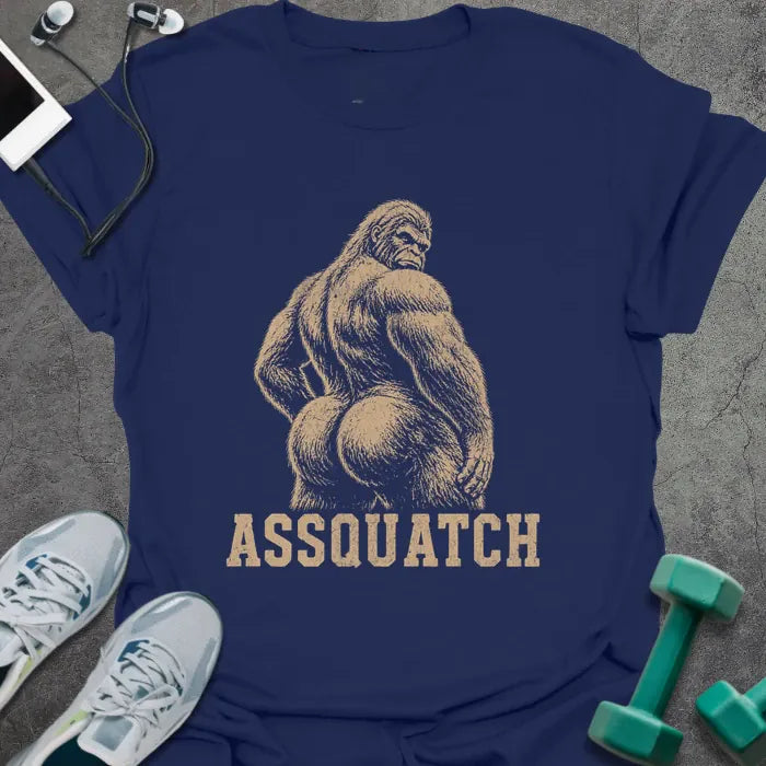 Navy t-shirt printed with "Assquatch" in white, with an illustration of Bigfoot from behind