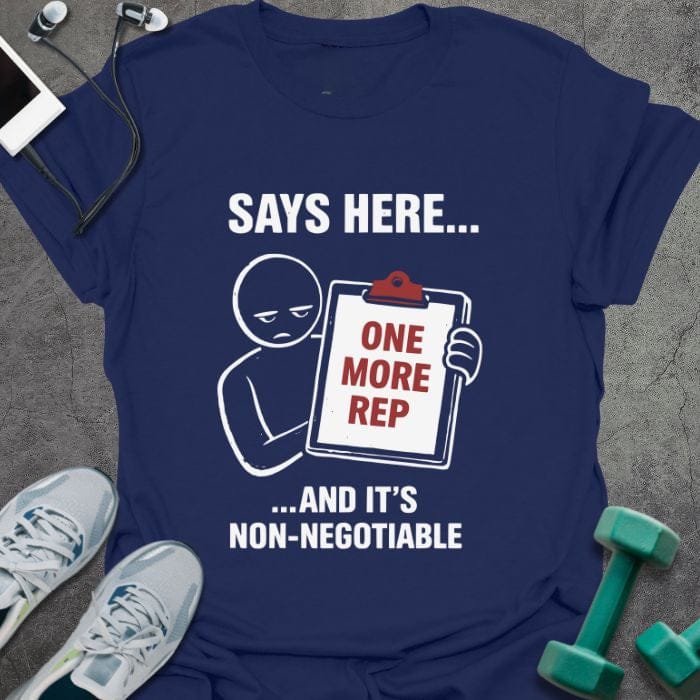 Navy t-shirt printed with "Says Here... One More Rep ...and It's Non-negotiable" in white, red, with a stick figure holding a clipboard