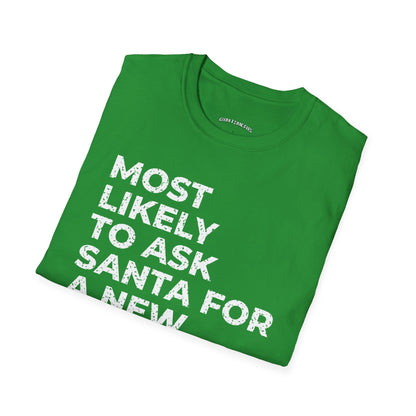 Folded Irish green t-shirt printed with "MOST LIKELY TO ASK SANTA FOR A NEW TRAINER" in white