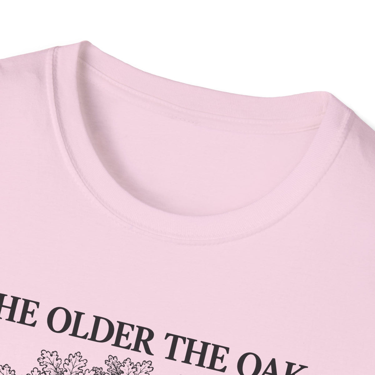 Close-up of the light pink t-shirt collar and the top of the print
