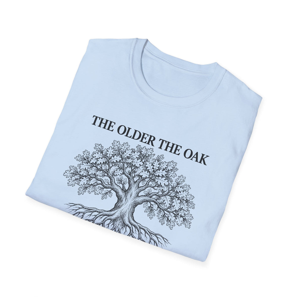 Folded light blue t-shirt printed with "THE OLDER THE OAK, THE STRONGER IT STANDS" in black, with a drawing of an oak tree and its roots