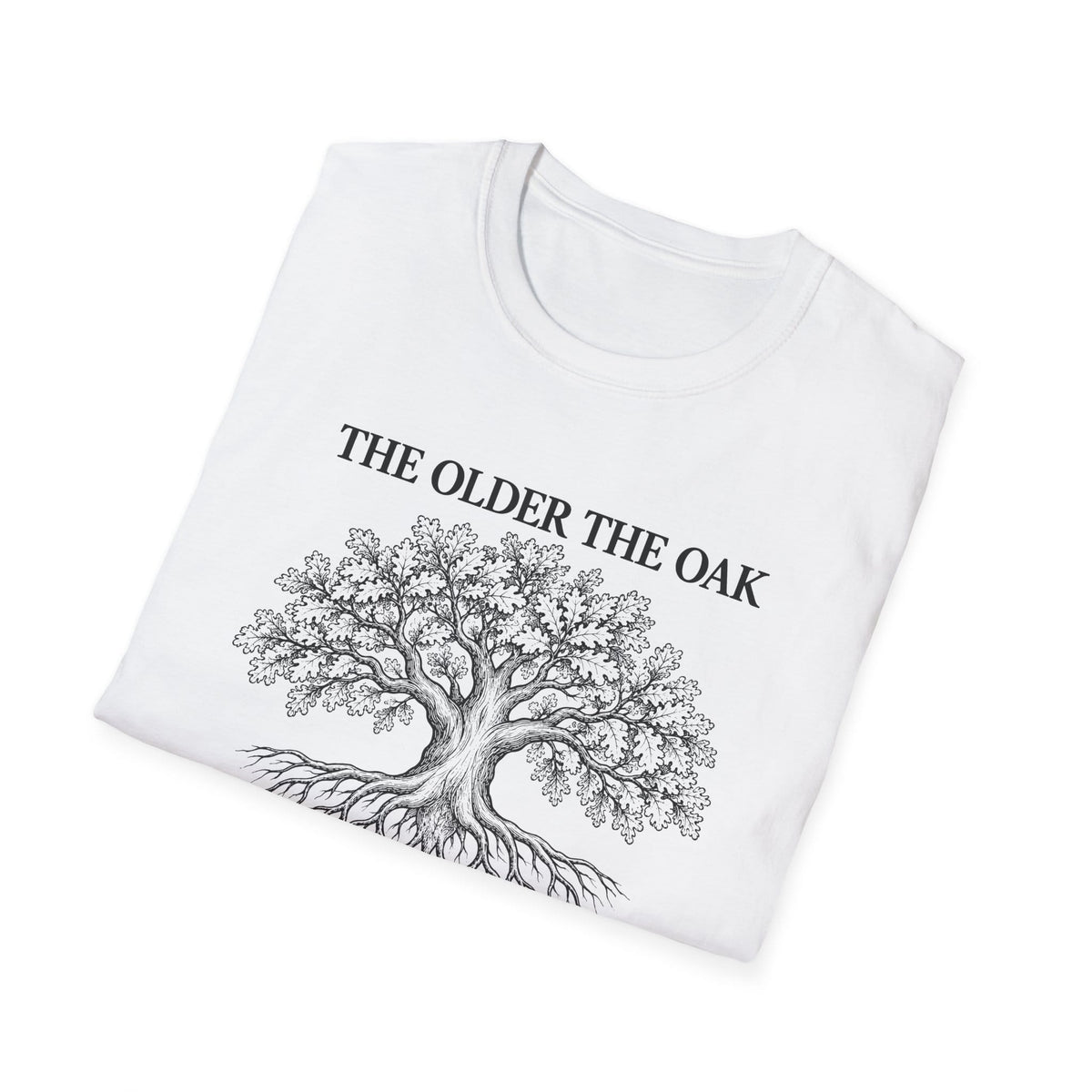 Folded white t-shirt printed with "THE OLDER THE OAK, THE STRONGER IT STANDS" in black, with a drawing of an oak tree and its roots