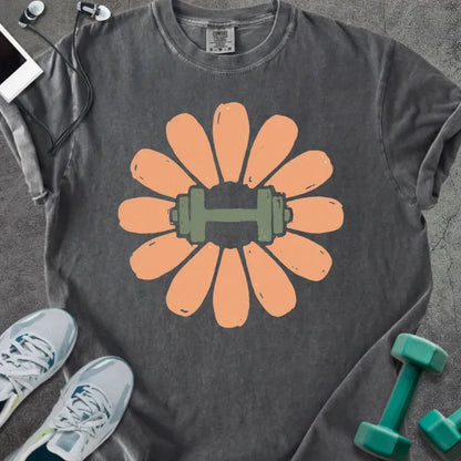Pepper t-shirt with coral/peach flower and dumbbell in center in peach and green