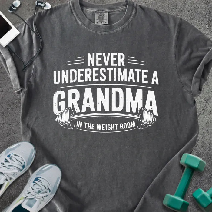 Pepper t-shirt printed with "Never Underestimate a Grandma in the Weight Room" in white, with a barbell graphic