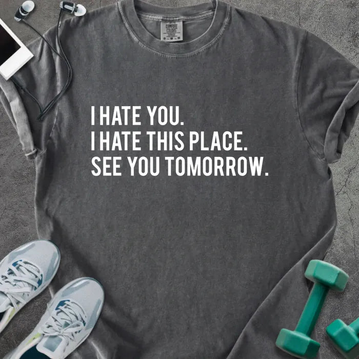 Pepper t-shirt printed with "I Hate You. I Hate This Place. See You Tomorrow." in white