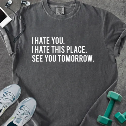 Pepper t-shirt printed with "I Hate You. I Hate This Place. See You Tomorrow." in white