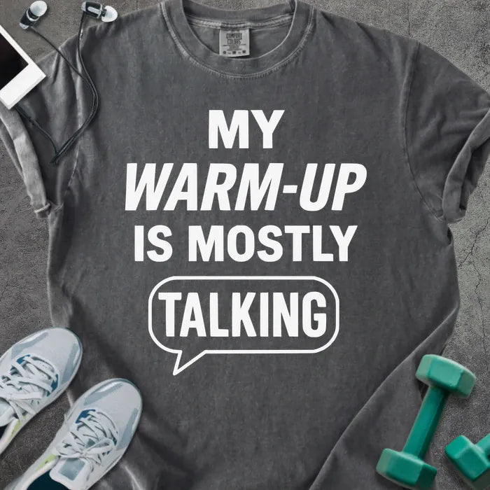 Pepper t-shirt printed with "My Warm-up is Mostly Talking" in white, with a speech bubble graphic