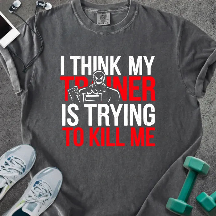 Pepper t-shirt printed with "I Think my Trainer is Trying to Kill Me" in red and white, with a trainer figure