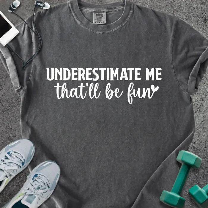 Pepper t-shirt printed with "UNDERESTIMATE ME that'll be fun" in white