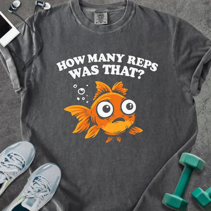 Pepper t-shirt printed with "How Many Reps Was That?", with an illustration of a wide-eyed goldfish and bubbles