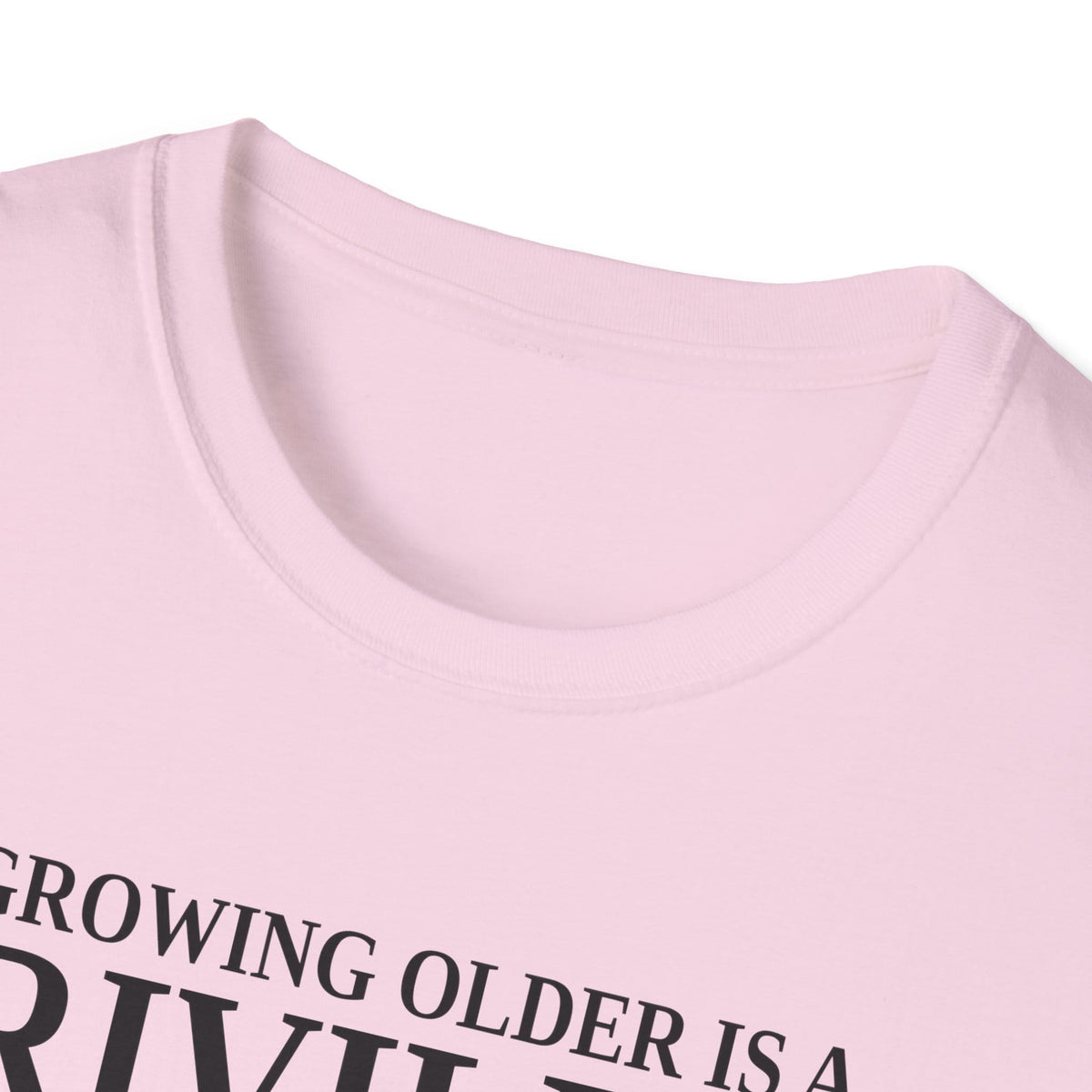 Close-up of the light pink t-shirt collar and the top of the print