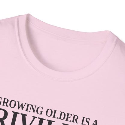 Close-up of the light pink t-shirt collar and the top of the print