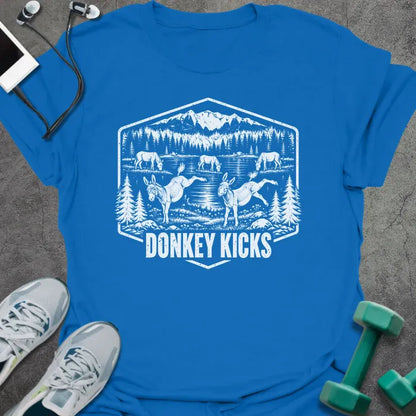 Royal blue t-shirt printed with "DONKEY KICKS" in white, with two donkeys kicking up their back legs by a mountain lake and pine trees