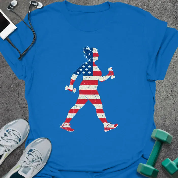 Royal blue t-shirt printed with a woman power walking with hand weights, filled with a distressed American flag