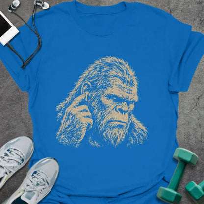 Royal blue t-shirt with an illustration of Bigfoot's face with a concerned expression in white