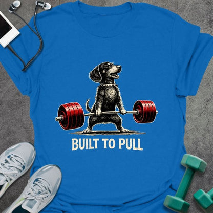 Royal blue t-shirt printed with "Built to Pull" in white, red, with a dog lifting a barbell