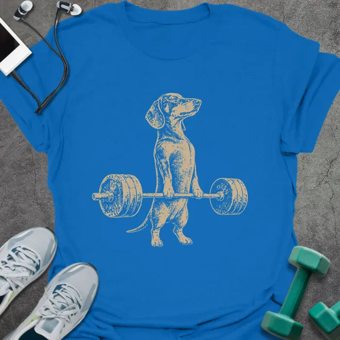 Royal blue t-shirt with an illustration of a Dachshund holding a barbell in white