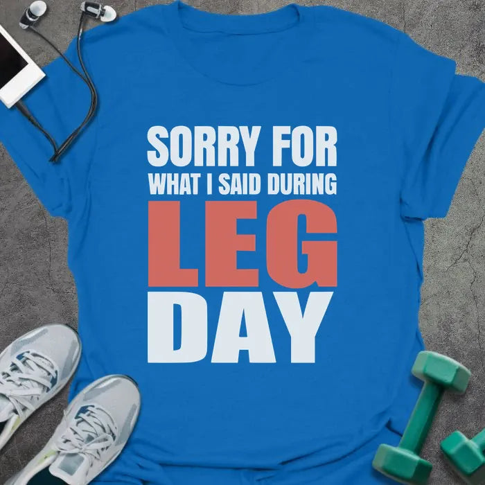 Royal blue t-shirt printed with "Sorry for What I Said During Leg Day" in white and red