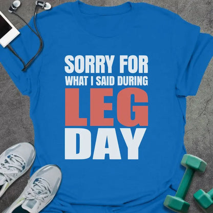 Royal blue t-shirt printed with "Sorry for What I Said During Leg Day" in white and red