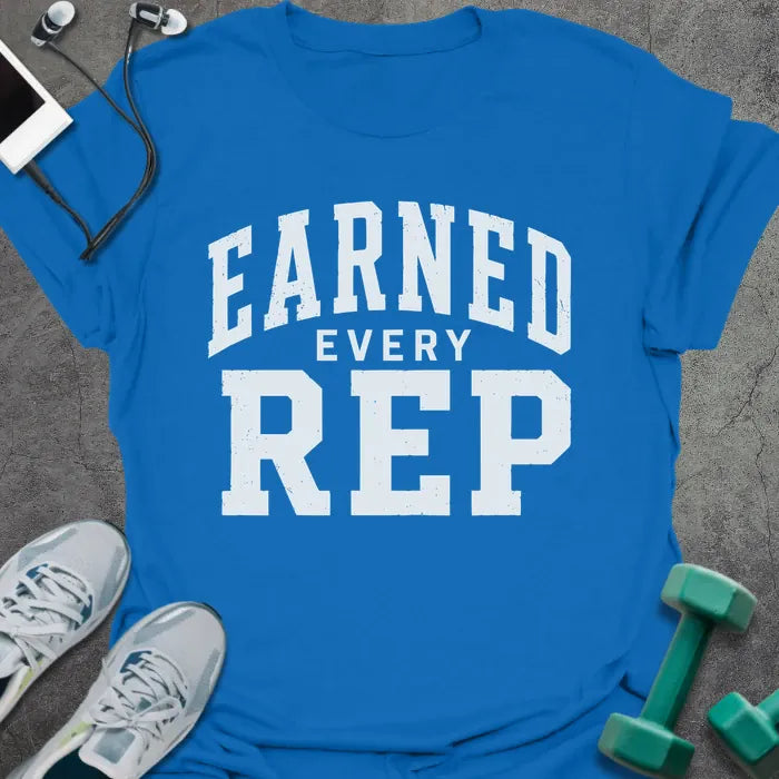Royal blue t-shirt printed with "Earned Every Rep" in white