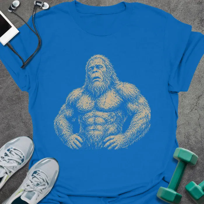 Royal blue t-shirt with an illustration of Bigfoot looking exhausted in white