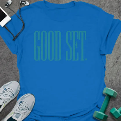 Royal blue t-shirt printed with "Good Set." in teal