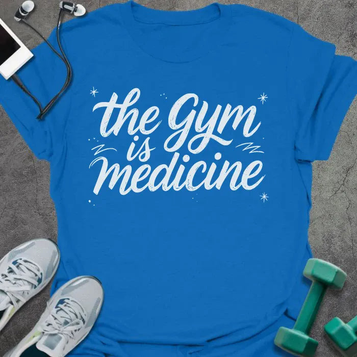 Royal blue t-shirt printed with "the gym is medicine" in white, with sparkles and decorative lines