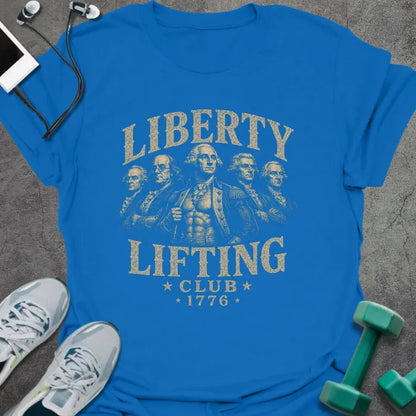 Royal blue t-shirt printed with "Liberty Lifting Club 1776" in white and gold, with Founding Fathers graphic
