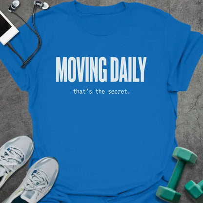 Royal blue t-shirt printed with "MOVING DAILY that's the secret." in white