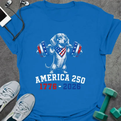 Royal blue t-shirt with an American flag dachshund with dumbbells graphic in white and red
