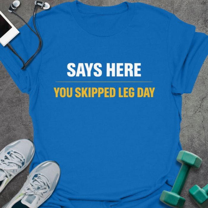 Royal blue t-shirt printed with "Says Here You Skipped Leg Day" in white, orange