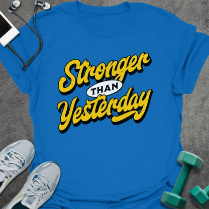 Royal blue t-shirt printed with "Stronger THAN Yesterday" in yellow