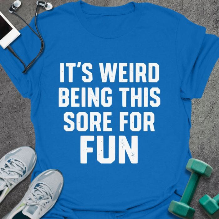Royal blue t-shirt printed with "It's Weird Being This Sore for Fun"