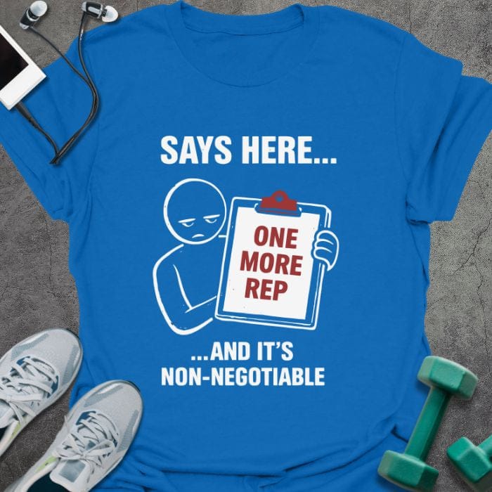 Royal blue t-shirt printed with "Says Here... One More Rep ...and It's Non-negotiable" in white, red, with a stick figure holding a clipboard