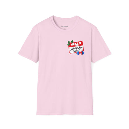 Light pink t-shirt printed with a small red name tag on the chest reading "HELLO my name is Santa's Little Lifter", with holly and a blue dumbbell tied with a red bow