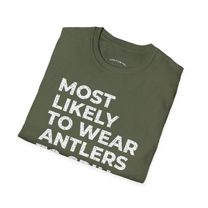 Folded military green t-shirt printed with "MOST LIKELY TO WEAR ANTLERS TO SPIN CLASS" in white