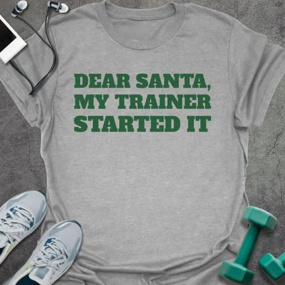 Sport grey t-shirt printed with "DEAR SANTA, MY TRAINER STARTED IT" in green