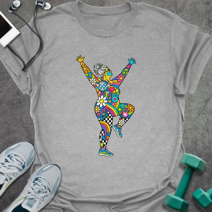 Sport grey t-shirt printed with an older woman with a gray bun dancing with her arms up, her body filled with colorful flowers, rainbows, hearts, music notes and a disco ball