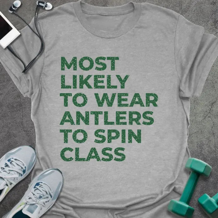 Sport grey t-shirt printed with "MOST LIKELY TO WEAR ANTLERS TO SPIN CLASS" in green