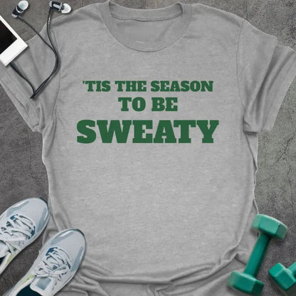 Sport grey t-shirt printed with "'TIS THE SEASON TO BE SWEATY" in green