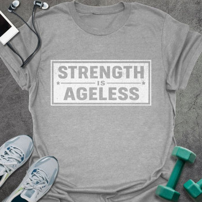 Sport grey t-shirt printed with "Strength is Ageless" in blue, with a rectangular badge design