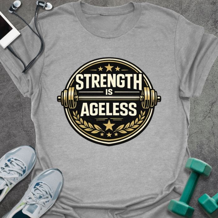 Sport grey t-shirt printed with "Strength is Ageless" in gold and white, with a circular barbell badge and stars