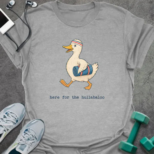 Sport grey t-shirt printed with "here for the hullabaloo", with a duck holding a dumbbell