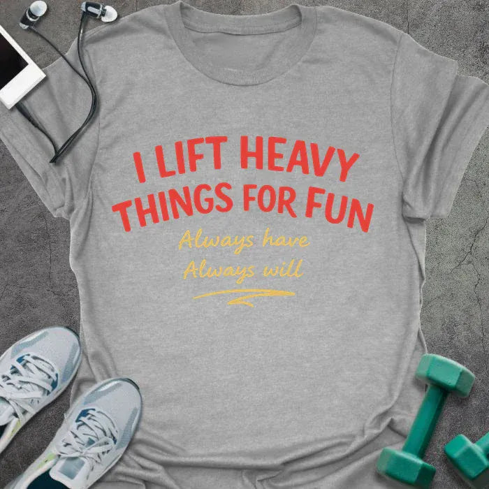 Sport grey t-shirt printed with "I LIFT HEAVY THINGS FOR FUN Always have. Always will." in black, with a retro illustration of a woman lifting a barbell