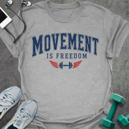 Sport grey t-shirt printed with "Movement is Freedom" in blue and red, with red winged barbells